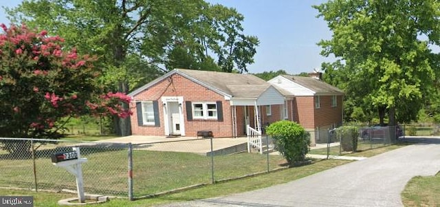7300 Dogwood Rd, Baltimore, MD 21244 - bungalow-style home featuring a fenced front yard and brick siding