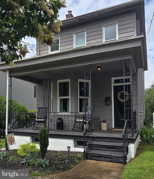 312 S Liberty St, Orwigsburg, PA 17961 - view of front of home featuring covered porch and a chimney