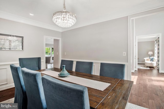 1506 White Tail Deer Ct, Annapolis, MD 21409 - dining area featuring a chandelier, wood finished floors, ornamental molding, and a wainscoted wall