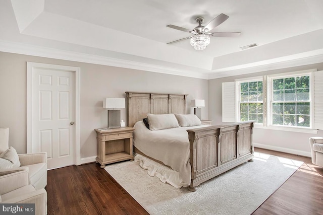 1506 White Tail Deer Ct, Annapolis, MD 21409 - bedroom with a tray ceiling, dark wood-type flooring, and ceiling fan
