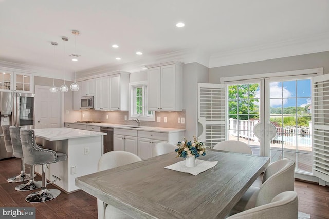 1506 White Tail Deer Ct, Annapolis, MD 21409 - kitchen featuring stainless steel appliances, a center island, white cabinets, crown molding, and recessed lighting