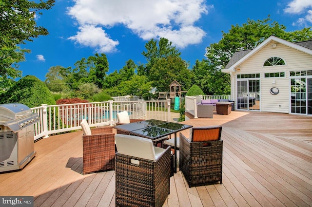 1506 White Tail Deer Ct, Annapolis, MD 21409 - deck with grilling area, outdoor dining space, an outdoor hangout area, and view of wooded area