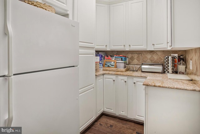 1506 White Tail Deer Ct, Annapolis, MD 21409 - kitchen featuring freestanding refrigerator, white cabinets, backsplash, and dark wood-style flooring