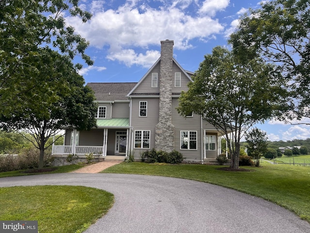 1347 Buckeystown Pike, Adamstown, MD 21710 - view of front facade with a porch, a chimney, a front yard, and a shingled roof