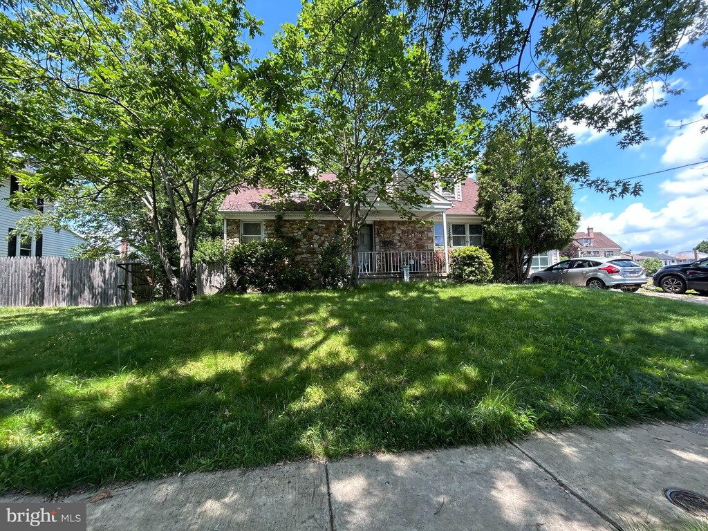 185 Berkley Ave, Lansdowne, PA 19050 - view of front facade featuring stone siding and a chimney