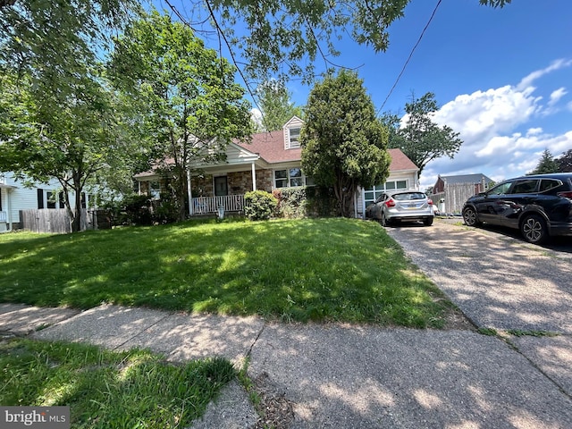 185 Berkley Ave, Lansdowne, PA 19050 - view of front of property featuring a porch, stone siding, and a garage
