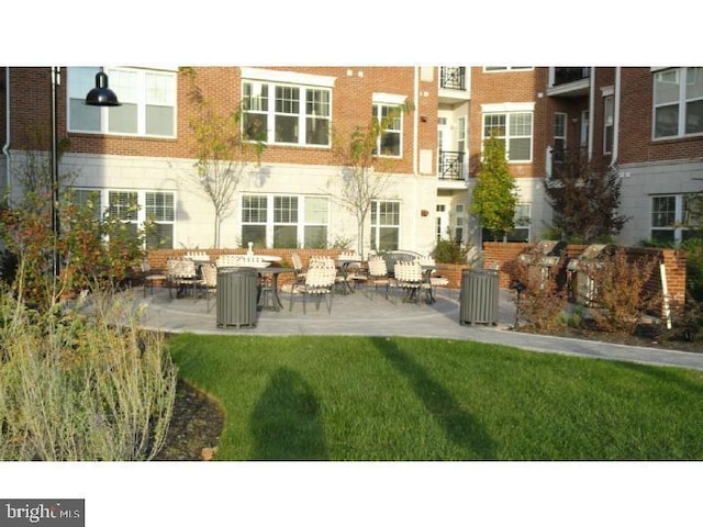 350 W Elm St Unit 3010, Conshohocken, PA 19428 - rear view of property with a patio, brick siding, and a yard