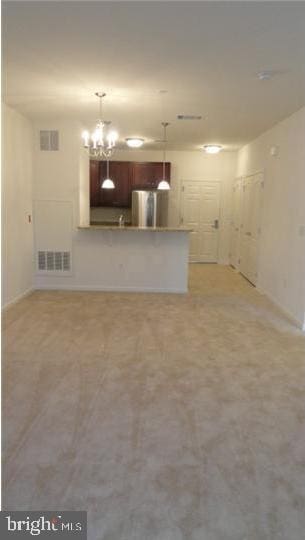 350 W Elm St Unit 3010, Conshohocken, PA 19428 - unfurnished living room featuring a chandelier and baseboards