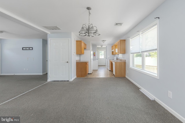380 Fowser Rd, Millville, NJ 08332 - kitchen featuring freestanding refrigerator, a chandelier, light carpet, light countertops, and open floor plan