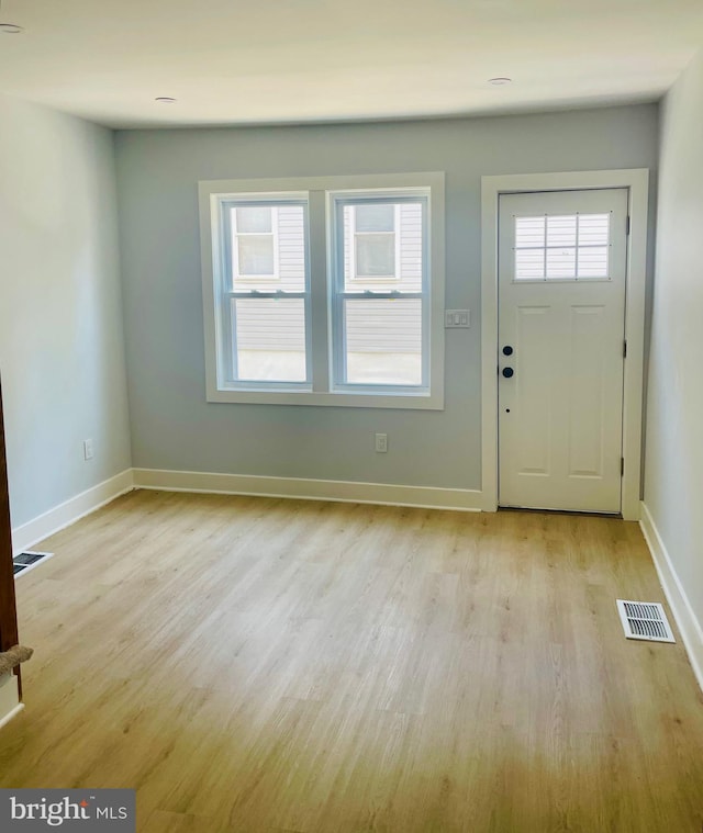213 N Willow St, Gloucester City, NJ 08030 - foyer entrance with light wood-style floors and baseboards