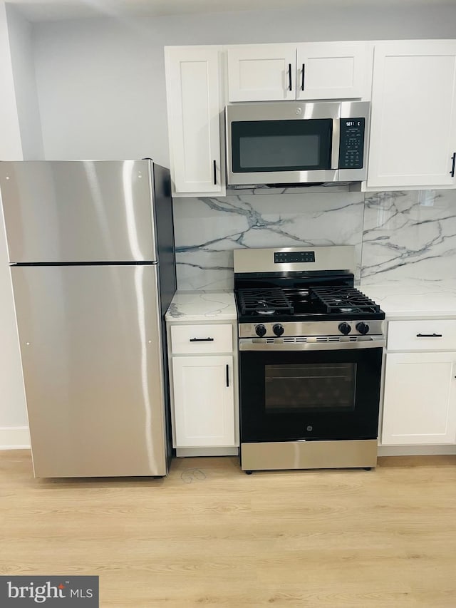 213 N Willow St, Gloucester City, NJ 08030 - kitchen featuring appliances with stainless steel finishes and white cabinets
