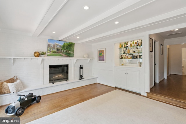 10905 Wickshire Way Unit G-2, North Bethesda, MD 20852 - unfurnished living room with wood finished floors, a fireplace, bar, beam ceiling, and recessed lighting