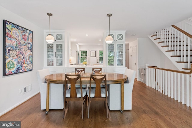 10905 Wickshire Way Unit G-2, North Bethesda, MD 20852 - dining area featuring wood finished floors and stairs