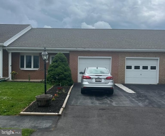 153 Southern Oak Dr, Hagerstown, MD 21740 - view of front facade with driveway, an attached garage, and brick siding