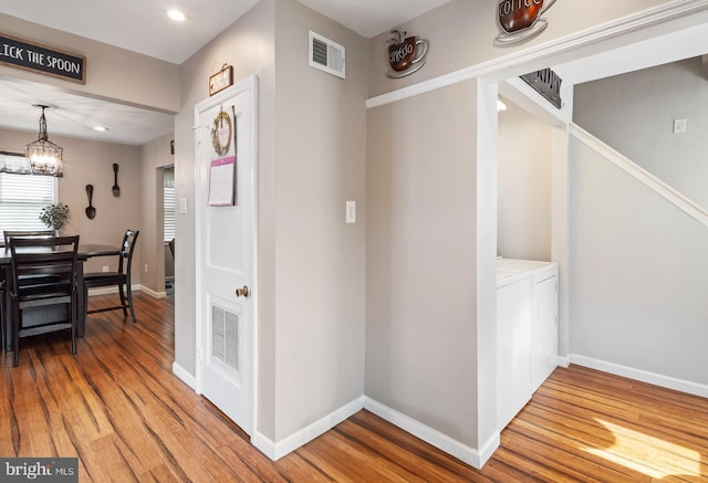 107 Philmar Ave, Cherry Hill, NJ 08003 - corridor featuring washer and dryer, light wood-type flooring, a chandelier, and recessed lighting