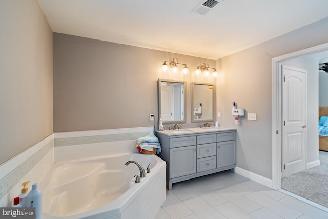 136 Tiller Ave, Manahawkin, NJ 08050 - ensuite bathroom with double vanity, a bath, and tile patterned flooring