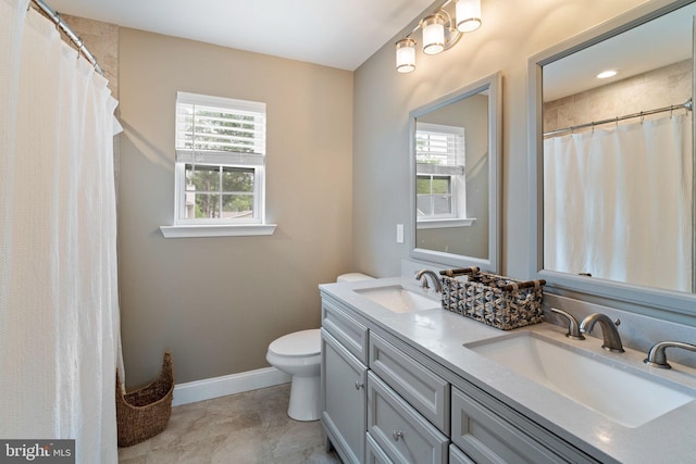 136 Tiller Ave, Manahawkin, NJ 08050 - bathroom with healthy amount of natural light, double vanity, a shower with shower curtain, and tile patterned floors