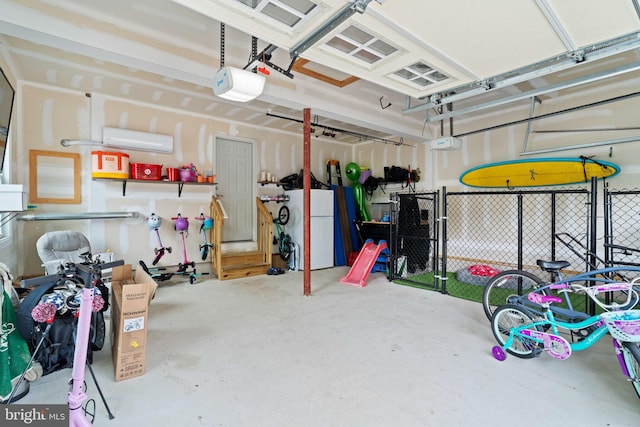 136 Tiller Ave, Manahawkin, NJ 08050 - garage featuring freestanding refrigerator, a garage door opener, and a wall mounted AC