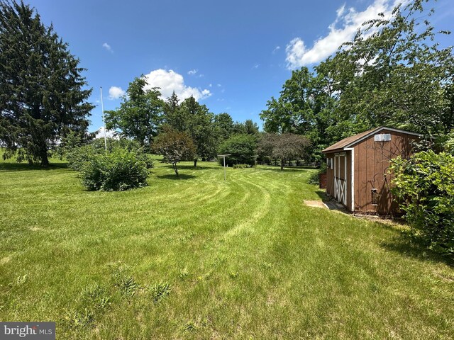 7819 Mentzer Gap Rd, Waynesboro, PA 17268 - view of grassy yard with a shed and view of scattered trees