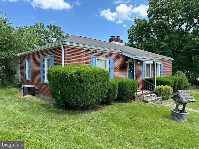 7819 Mentzer Gap Rd, Waynesboro, PA 17268 - view of front of home featuring brick siding, a chimney, and a front lawn