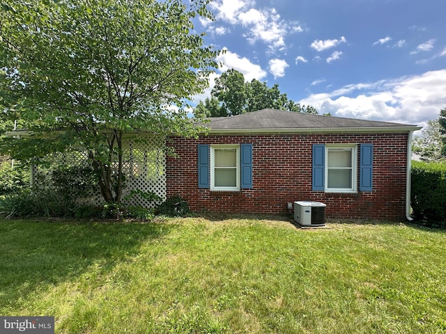 7819 Mentzer Gap Rd, Waynesboro, PA 17268 - view of home's exterior with brick siding and a lawn