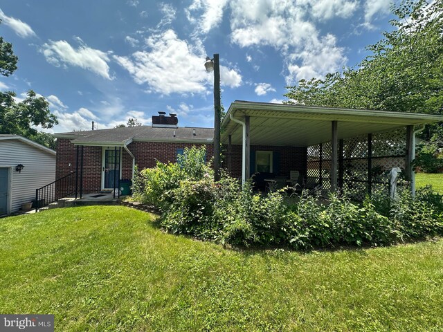 7819 Mentzer Gap Rd, Waynesboro, PA 17268 - rear view of property featuring a yard and brick siding