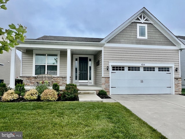 404 Paper Birch St, Middletown, DE 19709 - craftsman-style house featuring stone siding, concrete driveway, and a front lawn