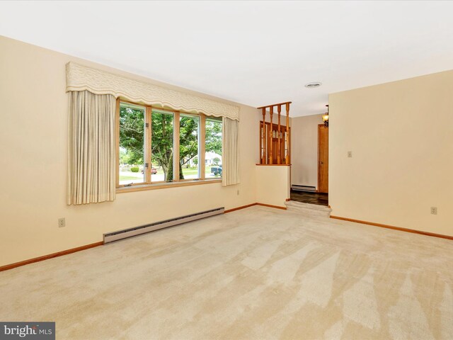 6505 Morningside Ct, Middletown, MD 21769 - empty room with a baseboard radiator, carpet flooring, a baseboard heating unit, and a chandelier