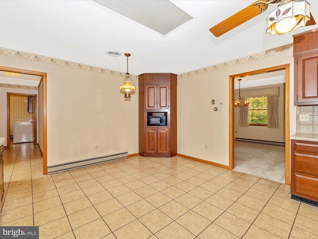 6505 Morningside Ct, Middletown, MD 21769 - unfurnished room with baseboard heating, wallpapered walls, light tile patterned floors, and a chandelier