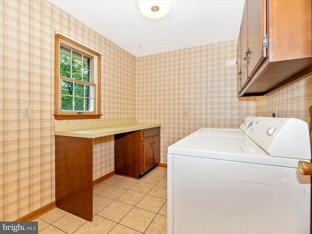 6505 Morningside Ct, Middletown, MD 21769 - laundry room featuring cabinet space, washing machine and dryer, light tile patterned flooring, and wallpapered walls