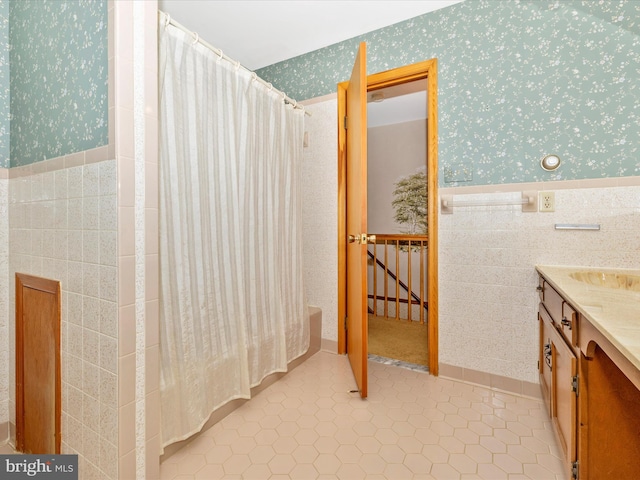 6505 Morningside Ct, Middletown, MD 21769 - full bathroom with wallpapered walls, vanity, wainscoting, shower / bath combo with shower curtain, and tile patterned flooring