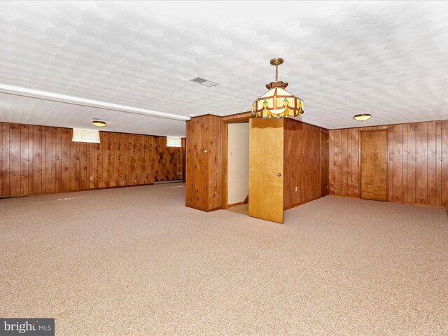 6505 Morningside Ct, Middletown, MD 21769 - spare room with wood walls and light colored carpet