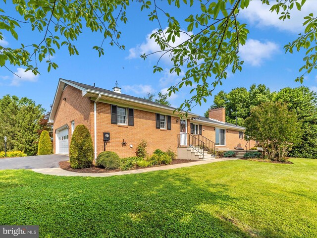 6505 Morningside Ct, Middletown, MD 21769 - view of front of home with a chimney, brick siding, and a front yard