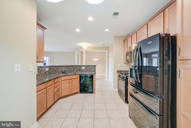 9711 Handerson Pl Unit 206, Manassas Park, VA 20111 - kitchen featuring black appliances, a peninsula, light tile patterned floors, dark stone counters, and recessed lighting