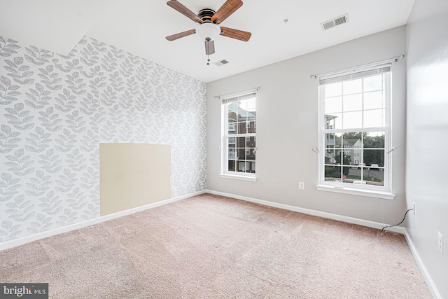 9711 Handerson Pl Unit 206, Manassas Park, VA 20111 - unfurnished room featuring wallpapered walls, a ceiling fan, carpet, and an accent wall