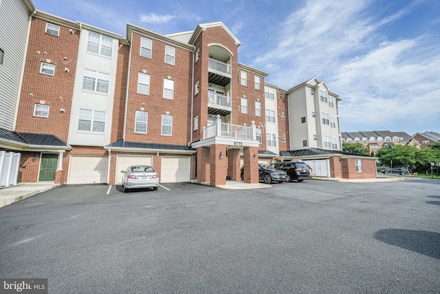 9711 Handerson Pl Unit 206, Manassas Park, VA 20111 - view of property with an attached garage