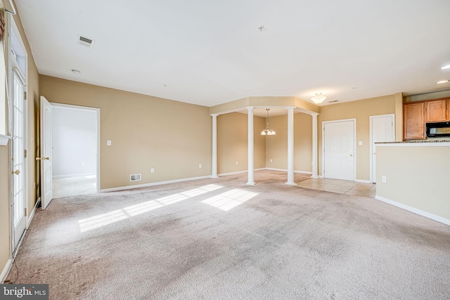 9711 Handerson Pl Unit 206, Manassas Park, VA 20111 - unfurnished living room with ornate columns and light colored carpet
