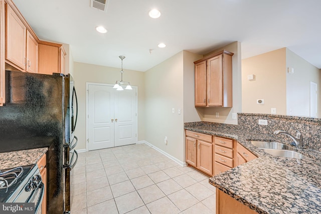 9711 Handerson Pl Unit 206, Manassas Park, VA 20111 - kitchen with range with gas stovetop, light tile patterned flooring, a peninsula, light brown cabinets, and recessed lighting