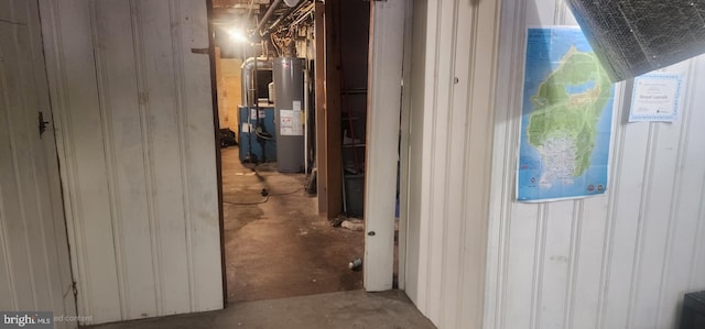 2308 W Mosher St, Baltimore, MD 21216 - hallway with unfinished concrete floors and gas water heater