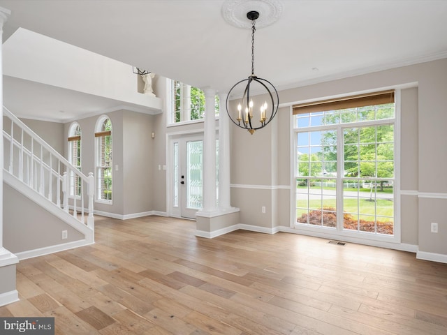 1015 S Creek View Ct, Churchton, MD 20733 - foyer entrance featuring light wood-style floors, a chandelier, healthy amount of natural light, stairs, and ornamental molding