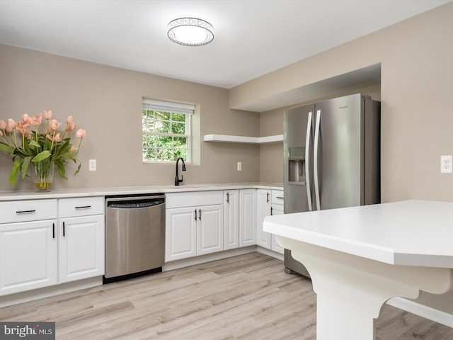 1015 S Creek View Ct, Churchton, MD 20733 - kitchen with stainless steel appliances, white cabinetry, light wood-type flooring, open shelves, and light countertops