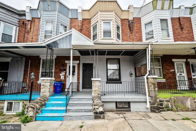 2750 N 28th St, Philadelphia, PA 19132 - view of front facade featuring covered porch and brick siding