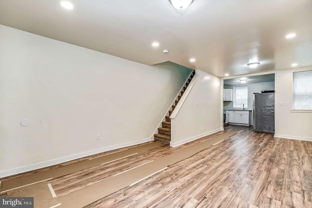 2750 N 28th St, Philadelphia, PA 19132 - unfurnished living room with stairs, recessed lighting, and wood finished floors