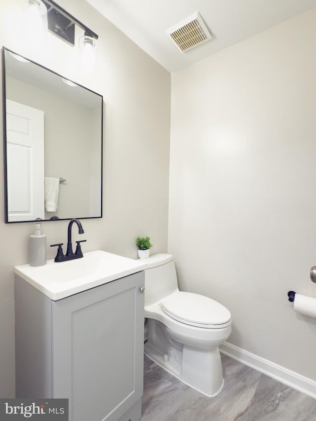 5646 Mount Burnside Way, Burke, VA 22015 - half bathroom with vanity and wood finished floors