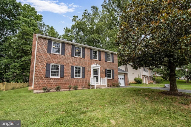 5646 Mount Burnside Way, Burke, VA 22015 - colonial-style house with brick siding, an attached garage, and asphalt driveway