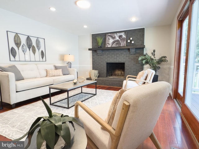 5646 Mount Burnside Way, Burke, VA 22015 - living area with wood finished floors, a brick fireplace, and recessed lighting