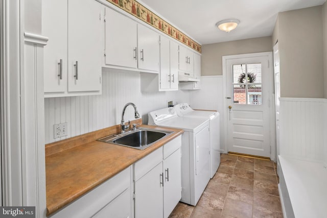 51 E Ann Rd, Broomall, PA 19008 - washroom with cabinet space, washing machine and clothes dryer, wainscoting, and stone finish flooring