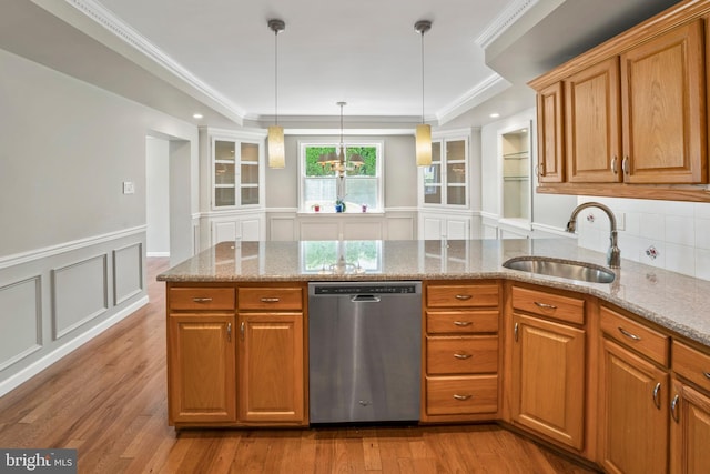 51 E Ann Rd, Broomall, PA 19008 - kitchen featuring dishwasher, a peninsula, wood finished floors, a decorative wall, and light stone counters