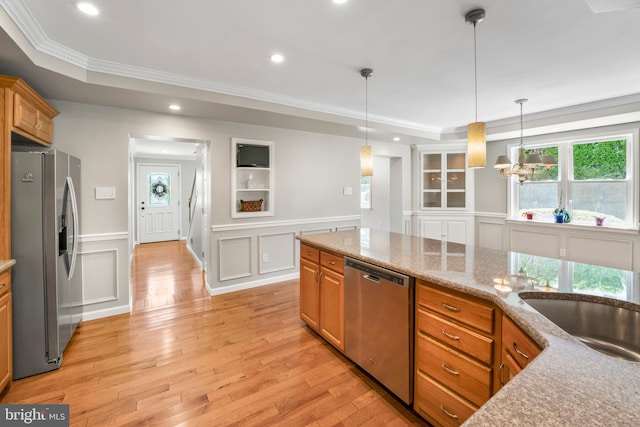 51 E Ann Rd, Broomall, PA 19008 - kitchen featuring stainless steel appliances, a decorative wall, a raised ceiling, crown molding, and light wood finished floors