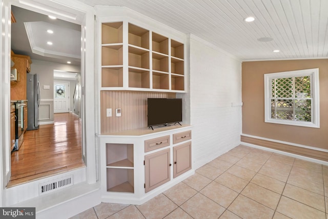 51 E Ann Rd, Broomall, PA 19008 - unfurnished living room featuring crown molding, healthy amount of natural light, light tile patterned floors, built in shelves, and recessed lighting